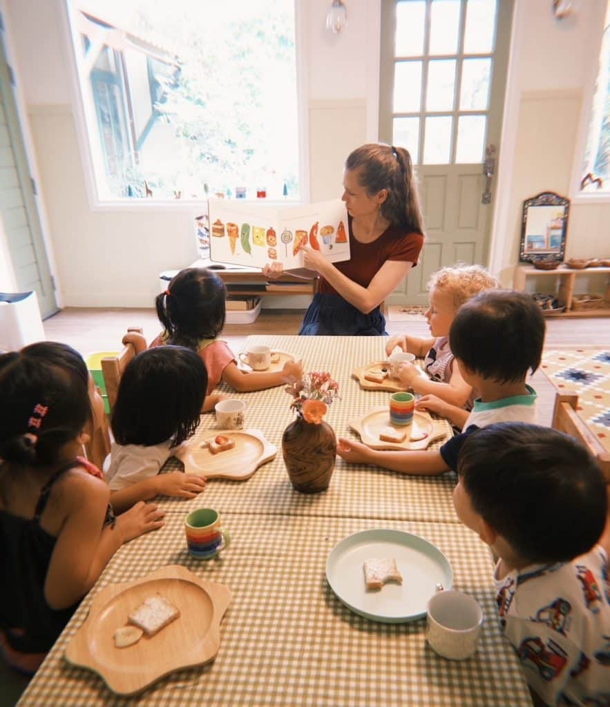 Children crafting their own meals during a small-group activity at Firefly Forest School’s low-ratio school in Bangkok.

