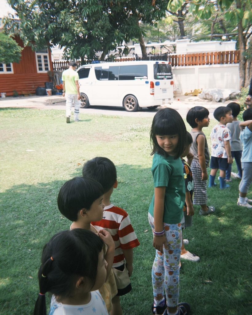 Children journaling about nature during a playgroup at Firefly Forest School in Bangkok.

